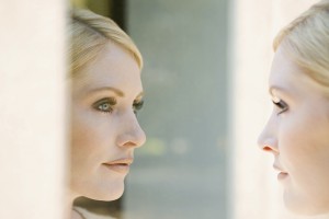Woman looking at her reflection